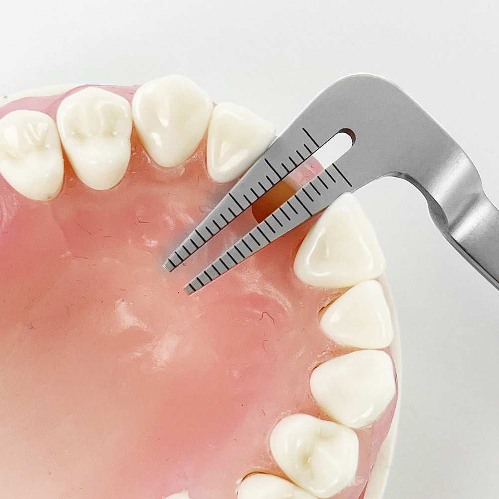 Anterior self-centering implant guide from Power Implant Guide Kit positioned between adjacent teeth