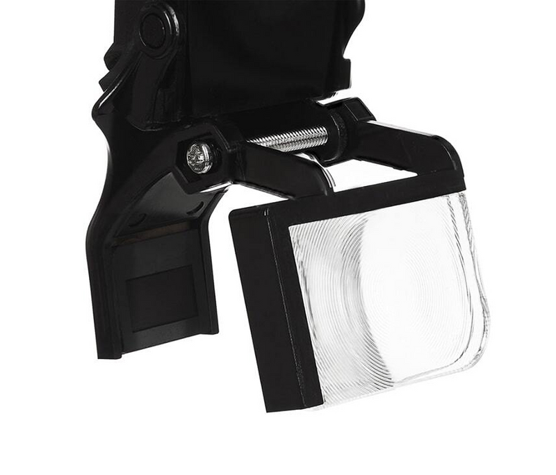 Flip-down OLED viewfinder attachment on Dr. Kim 4K headlamp camera system for real-time framing and positioning